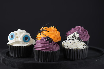 Halloween cupcakes with buttercream and holiday decoration. Halloween muffin. Halloween creative food.