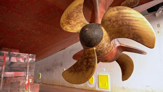 Ships thruster seen in drydock before cleaning - Moving slowly around twin screw schottel azimuth propeller - Westcon Norway