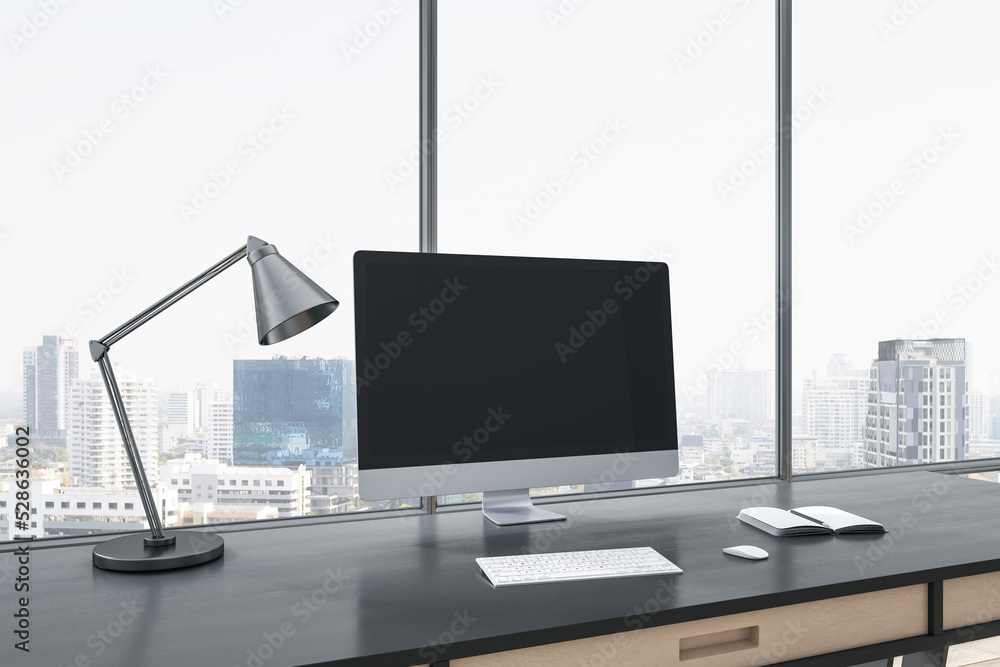 Aufkleber Close up of empty computer screen on gray office desktop with objects, lamp and supplies on panoramic window and city view background. Mock up, 3D Rendering.