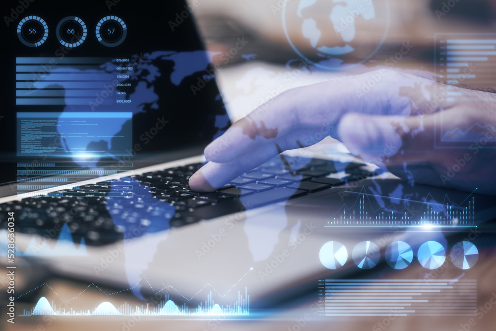Poster Close up of businessman hand using laptop keyboard with abstract map and business chart hologram on blurry background. Investor, finance and financial dashboard concept. Double exposure.