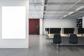 Modern designer coworking office interior with empty white mock up poster on wall, furniture, bookcase and equipment. 3D Rendering.