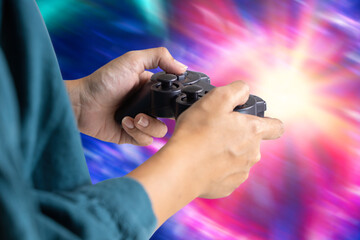 Video game console controller in gamer hands. Close up of child hands playing the video game in the bed room