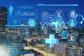 Illuminated aerial cityscape of Seattle, downtown at night time, Washington, USA. Health care digital medicine hologram. The concept of treatment and disease prevention