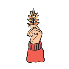 The hand holds autumn leaf. The symbol, icon of enjoyment in fall.