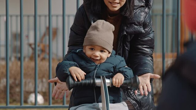 it is always a good idea to go to the playground with mom. High quality 4k footage