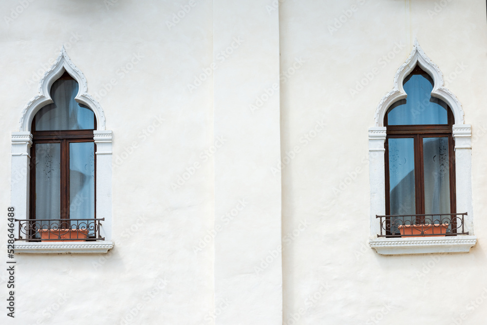 Wall mural close-up of two ancient windows with arch in venetian gothic style, small town of spilimbergo, porde