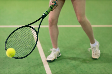 Fototapeta na wymiar Tennis woman player legs playing training with racket and ball at court.
