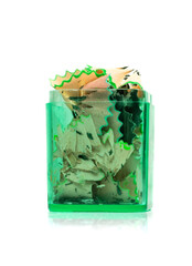 Fototapeta premium Color Wood Pencil Shavings in Pencil Sharpener Isolated