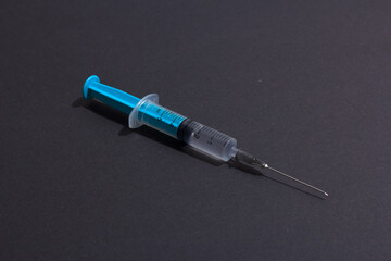 Disposable plastic syringe prepared for injection and vaccination in the hospital. The concept of medicine and health