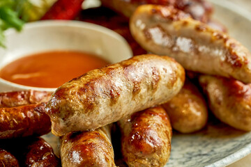 German grilled sausages. Close-up selective focus. An appetizer for beer