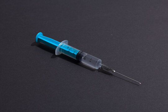 Disposable plastic syringe prepared for injection and vaccination in the hospital. The concept of medicine and health