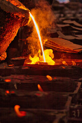 Pouring molten steel from the ladle into a mold in a casting unit