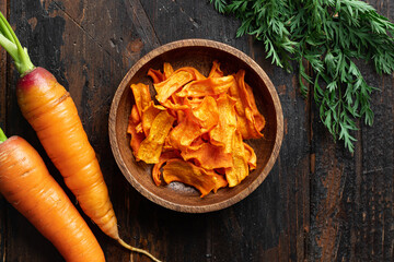 Dried carrot chips, vegan food, background, top view