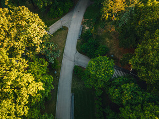 City park from above, summer evening at city park, Pedestrian paths and crosswalks in city park. Green area in the city