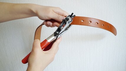 Punch a hole in the belt