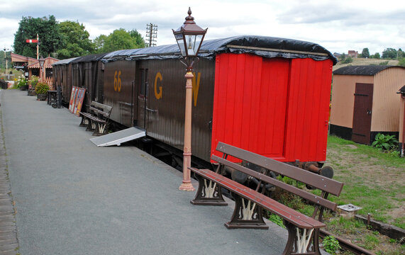 Old Railway Wagon and Empty Bench on Deserted Platform of Heritage Railway
