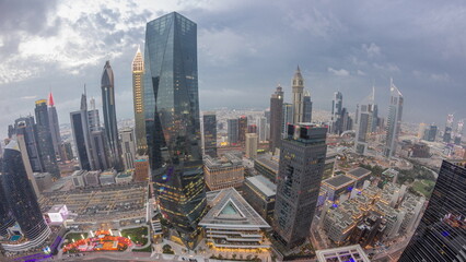 Panorama of futuristic skyscrapers after sunset in financial district business center in Dubai day...