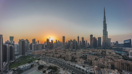 Naklejka na ściany i meble Dubai Downtown day to night transition timelapse with tallest skyscraper and other towers