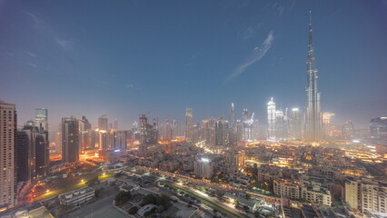Obraz premium Dubai Downtown night to day timelapse with tallest skyscraper and other towers