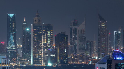 Fototapeta na wymiar Rows of skyscrapers in financial district of Dubai aerial all night timelapse.