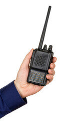 Man's hand holding walkie-talkie, handheld radio communication device in black color with keyboard and display. Isolated on white background.