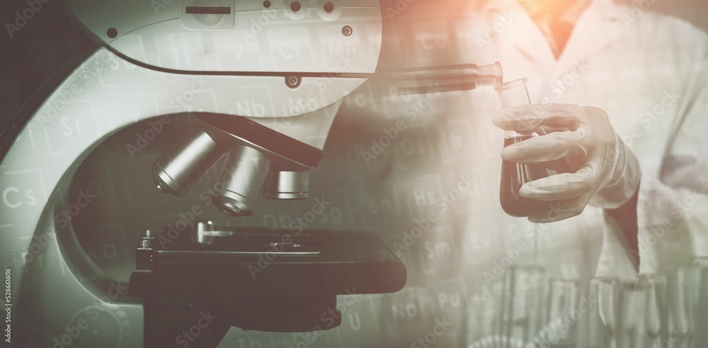 Poster scientist with a microscope in laboratory