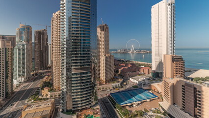 Obraz premium Panoramic view of the Dubai Marina and JBR area and the famous Ferris Wheel aerial timelapse