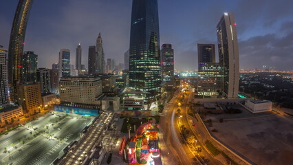 Fototapeta na wymiar Panorama of Dubai International Financial district aerial night to day timelapse. View of business office towers.