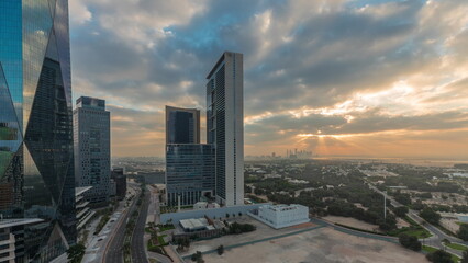 Dubai International Financial district aerial night to day timelapse. Panoramic view of business office towers.