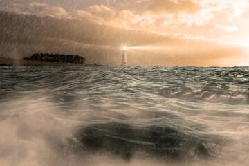 Stormy sea with lighthouse