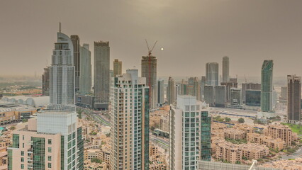 Fototapeta na wymiar Aerial panoramic sunrise over big futuristic city timelapse. Business bay and Downtown