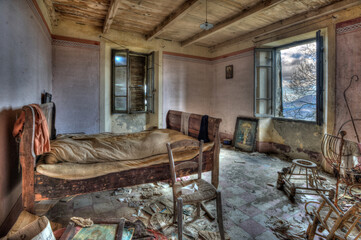 Italy, September 2022. Bedroom of an abandoned house