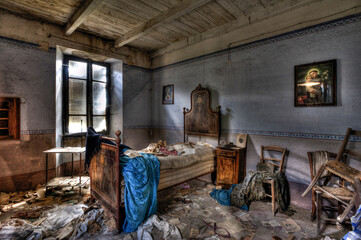 Italy, September 2022. Bedroom of an abandoned house