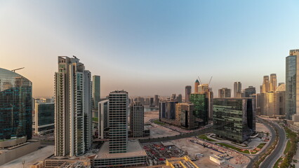 Business Bay Dubai skyscrapers with water canal aerial timelapse.