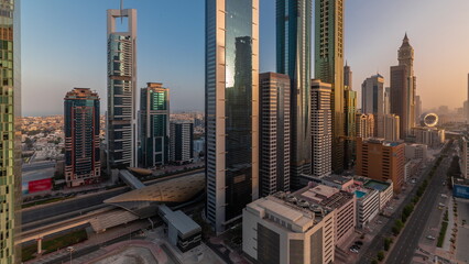 Aerial view of Dubai International Financial District with many skyscrapers timelapse.