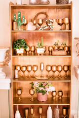 a closet niche with gold and green decorations