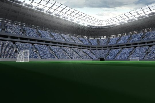 Vast football stadium with fans in blue