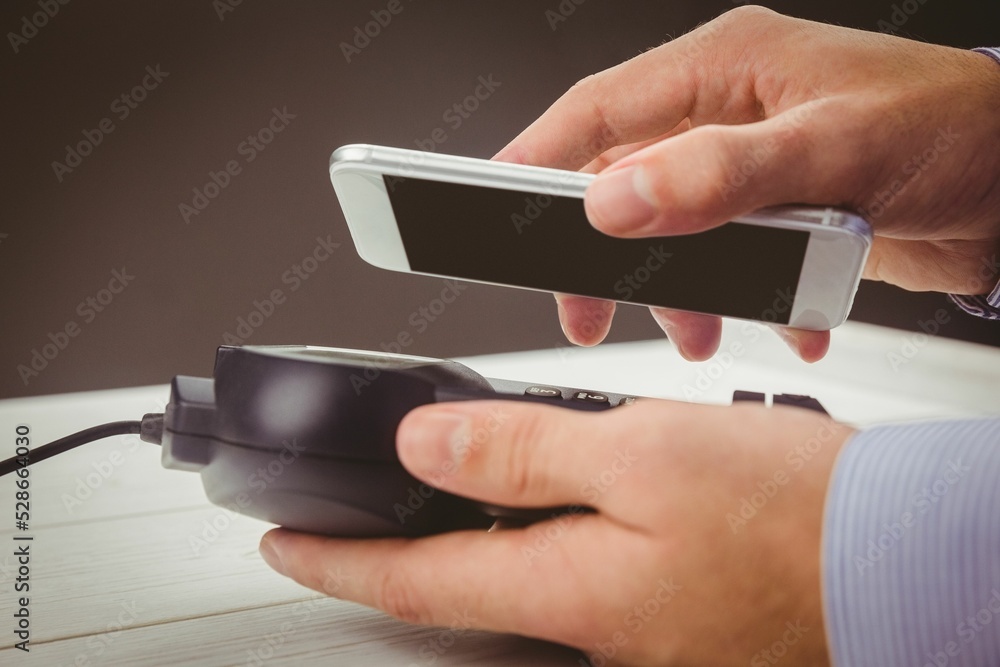 Poster man using smartphone to express pay