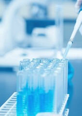 Scientist dropping the reagent into test tube for reaction testing