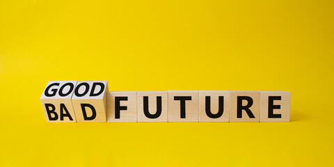 Good and bad Future symbol. Turned wooden cubes with words Bad Future and Good Future. Beautiful yellow background. Business concept. Copy space