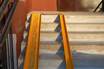 New yellow ramps on the stairs at the entrance to the house, room