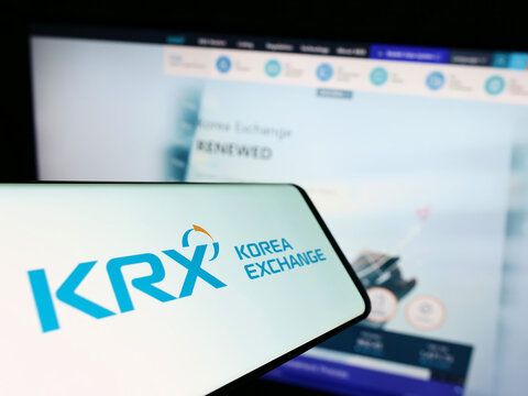 Stuttgart, Germany - 08-28-2022: Smartphone with logo of financial marketplace Korea Exchange (KRX) on screen in front of business website. Focus on center-right of phone display.