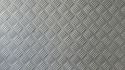 Checker plate abstract floor metal stainless  steel texture background with reflection light. 