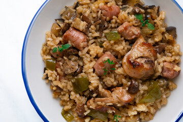 Rice paella with rabbit, sausages and green beans. Tapa traditional recipe in Valencia, Spain.