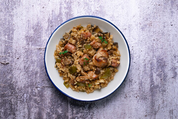 Rice paella with rabbit, sausages and green beans. Tapa traditional recipe in Valencia, Spain.