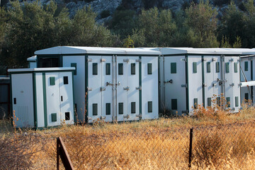 Fototapeta na wymiar Standard metal modules, independent portable cabins, prefabricated storage lockers