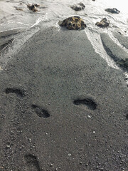 walking along the volcanic sand beaches, Lanzarote

