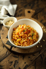 Pasta with tomato sauce and pine nuts