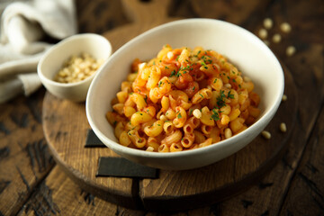 Pasta with tomato sauce and pine nuts