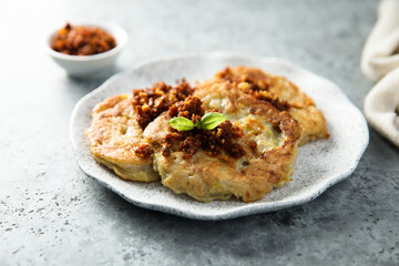 Homemade potato pancakes with red pesto